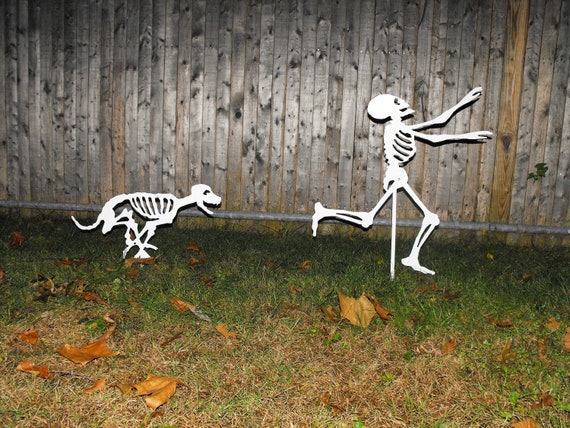 Halloween Yard Skeletons - dog skeleton chasing person skeleton -