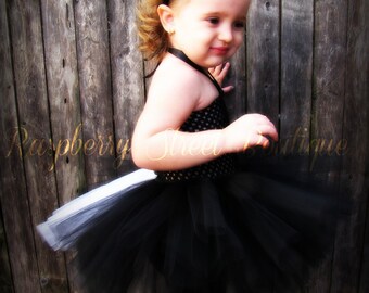 Lil' Stinker Stole cuddly skunk-headed keyhole scarf