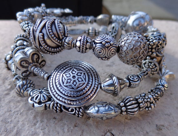 Loose fitting large coiled Sterling Silver Bali Bead Bangle
