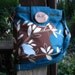 Birds, Chirps, and Joy shoulder bag with 7 large pockets, zipper closure, and adjustable strap
