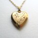 Beautiful 1940s gold vintage sweetheart locket on delicate 14k gold plated chain