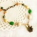 Beaded bracelet Fall colors "Dawn in the wood" birdhouse, in green and cream white, Autumn fashion