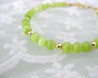 Lime green cats eye beaded bracelet. Simple and unique.