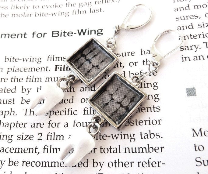square dental bitewing x ray earrings with a tooth