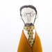 Bearded man in glasses wearing an orange jacket, green tie dotted and striped brown pants, ooak handmad cloth doll for him