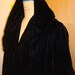 Swing coat with dramatic hood