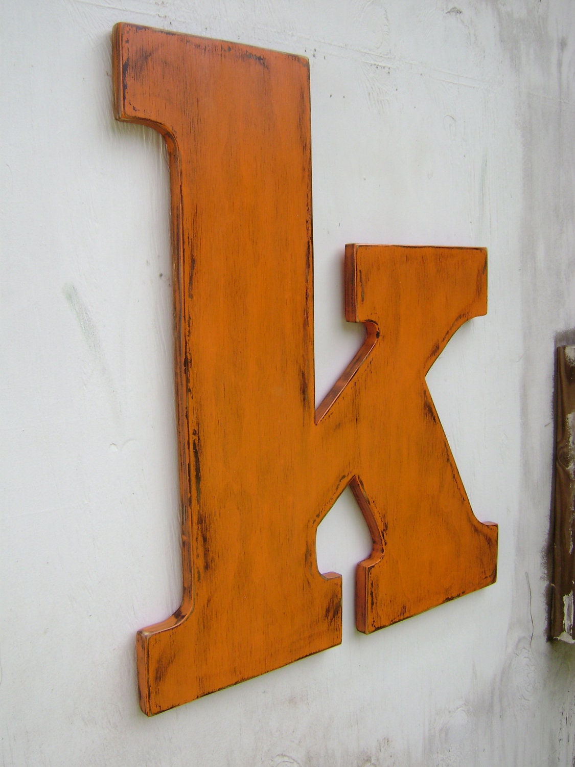 Large wooden lowercase letter k wedding decor