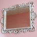mirror ornate shabby chic white and gold scroll detailing Hollywood regency or Paris apartment white and gold scroll detailing