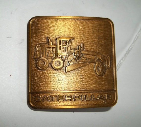 Caterpillar Grader brass belt buckle Vintage by JDsBasementetc
