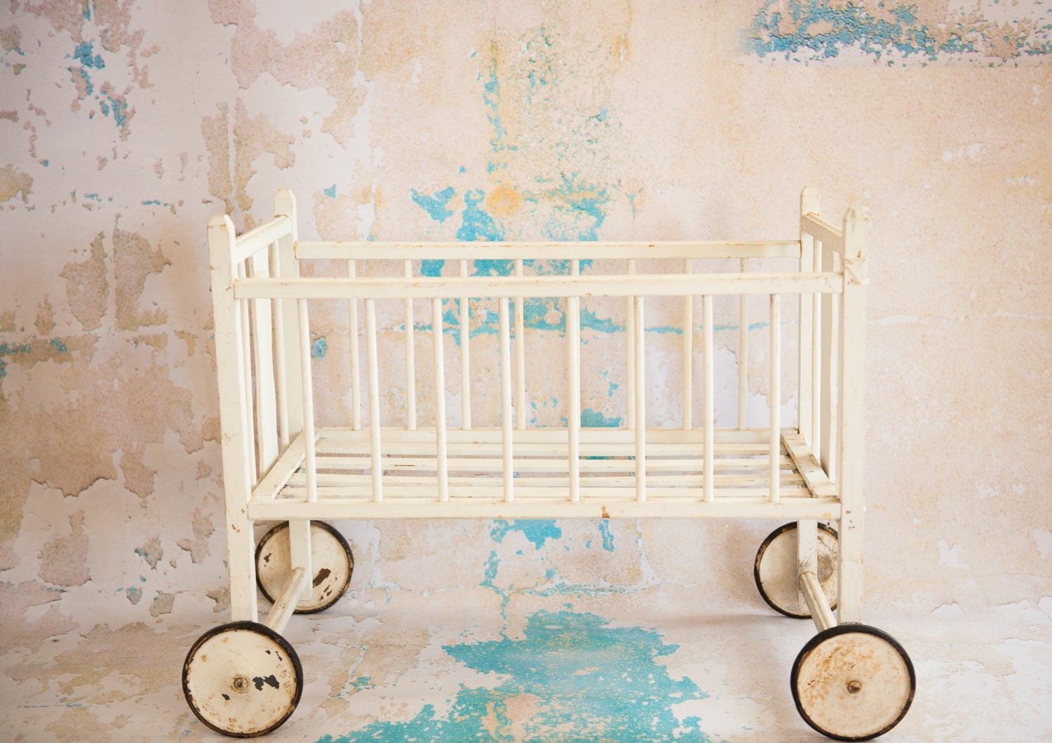 vintage antique cream doll crib on wheels photo prop