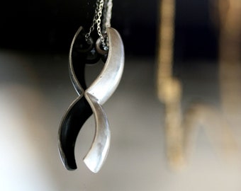 minimalist brushed silver pendant