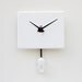 Clock created from a recycled Apple ibook laptop cover