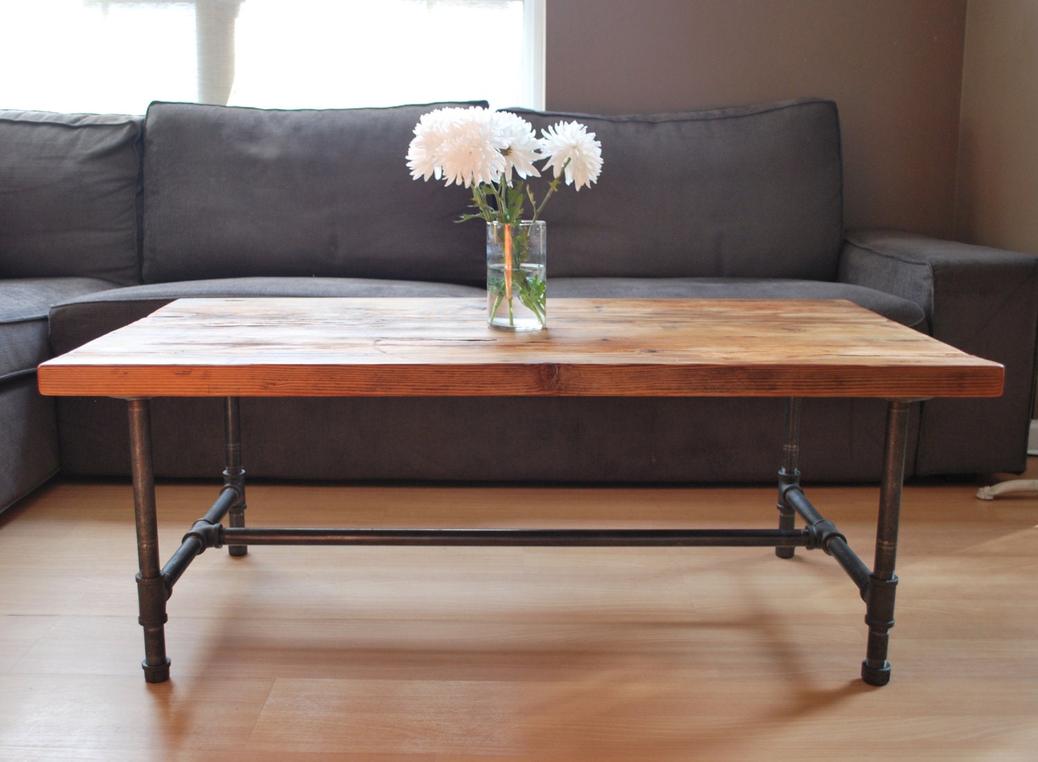 Wood Coffee table with steel pipe legs made of by UrbanWoodGoods