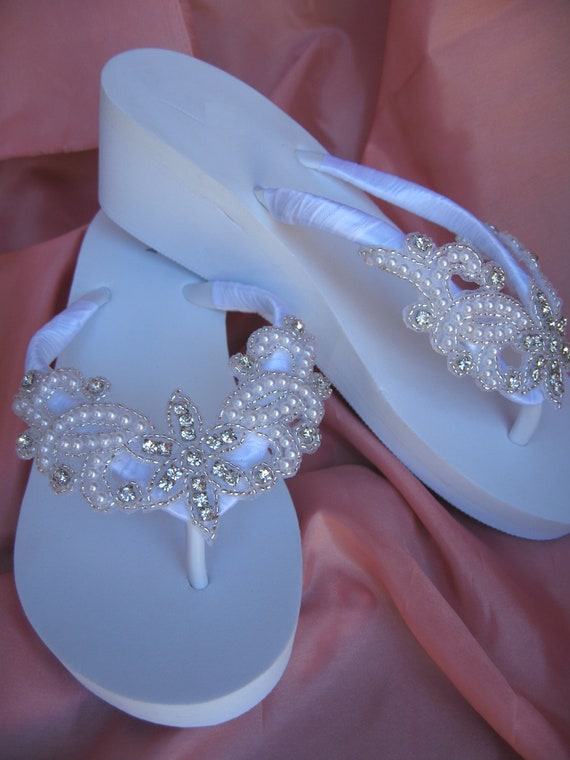 white beaded flip flops