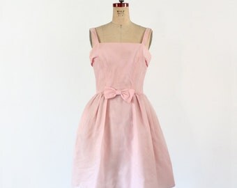 1960s pink cocktail dress with bow