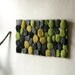 Felted rug with green and grey stones