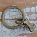 Vintage brass curtain clip.
