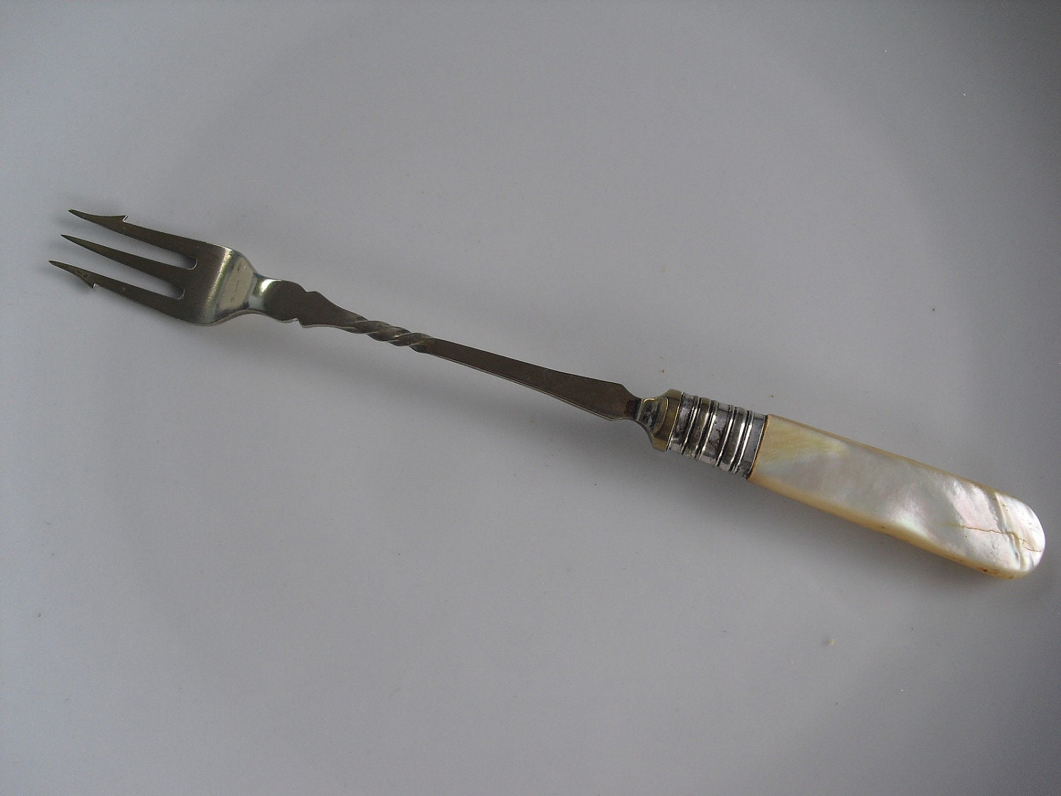 Vintage English EPNS pickle fork with motherofpearl handle