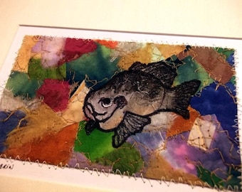 Fiber art, fish sketch on mixed-media abstract background, matted