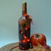 wine bottle lamp, autum leaves, orange, Thanksgiving