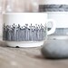 Handpainted cup "somewhat angular", black and white