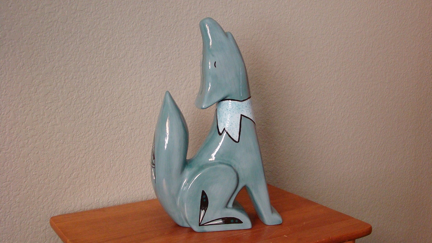 Large howling coyote statue