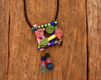 Dichroic Fused Glass Pendant with Chrystal Beads and Wire work on an 18" Black Cord. pendant measures 2 1/2"1 3/4
