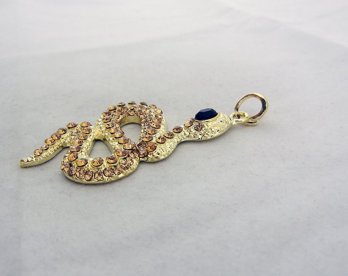 Gold tone Snake Pendant with Topaz Rhinestones Black Eye Accent