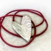 Textured Valentine Heart pendant in Sterling Silver on Red leather