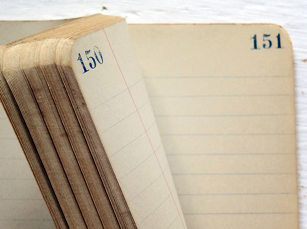 vintage composition book with ruled pages numbered and ruled