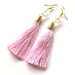 Light pink thread tassel and clear bead golden earrings