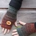 handknit mittens with wooden button in mixed green and russet