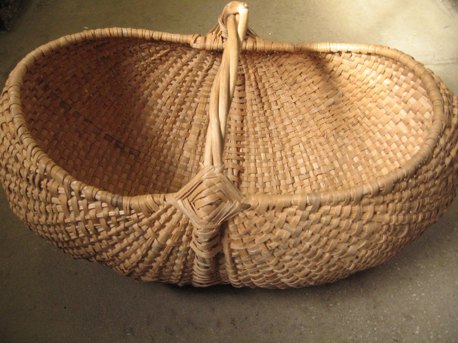 giant vintage buttocks basket with woven handle