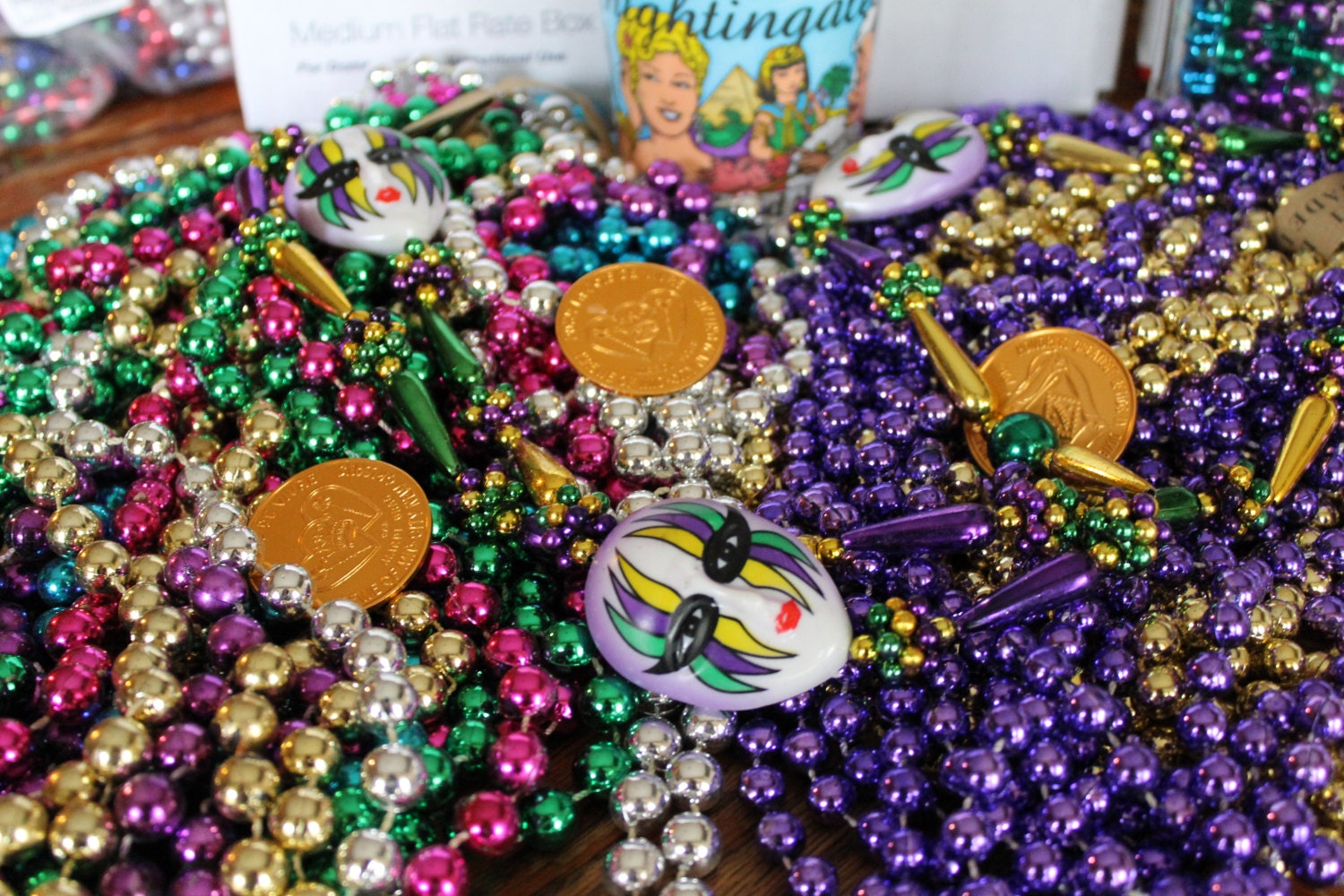 Mardi Gras beads and Coca-cola glass