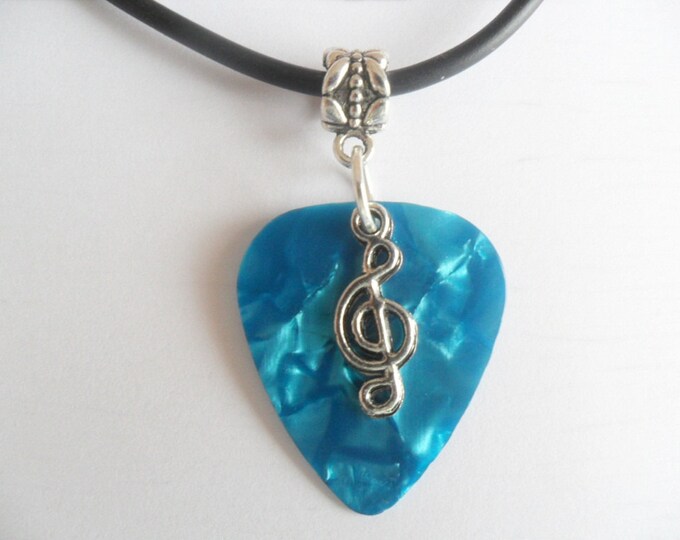 Blue Turquoise Guitar pick necklace with treble clef music note charm and adjustable cord.