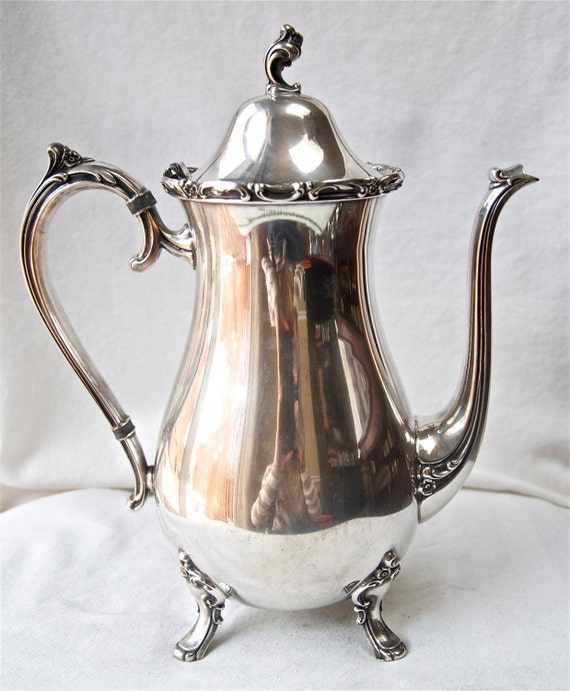 Vintage 1847 Rogers Bros. Reflection teapot with feet...silver