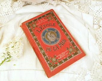 Antique French Book with an Ornate Red and Gold Guilt Cover