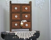Primitive, Small 6 draw wooden bureau, jewelry box. Dark Natural Wood with white knobs Primitive, Small 6 draw wooden bureau, jewelry box. Dark Natural Wood with white knobs