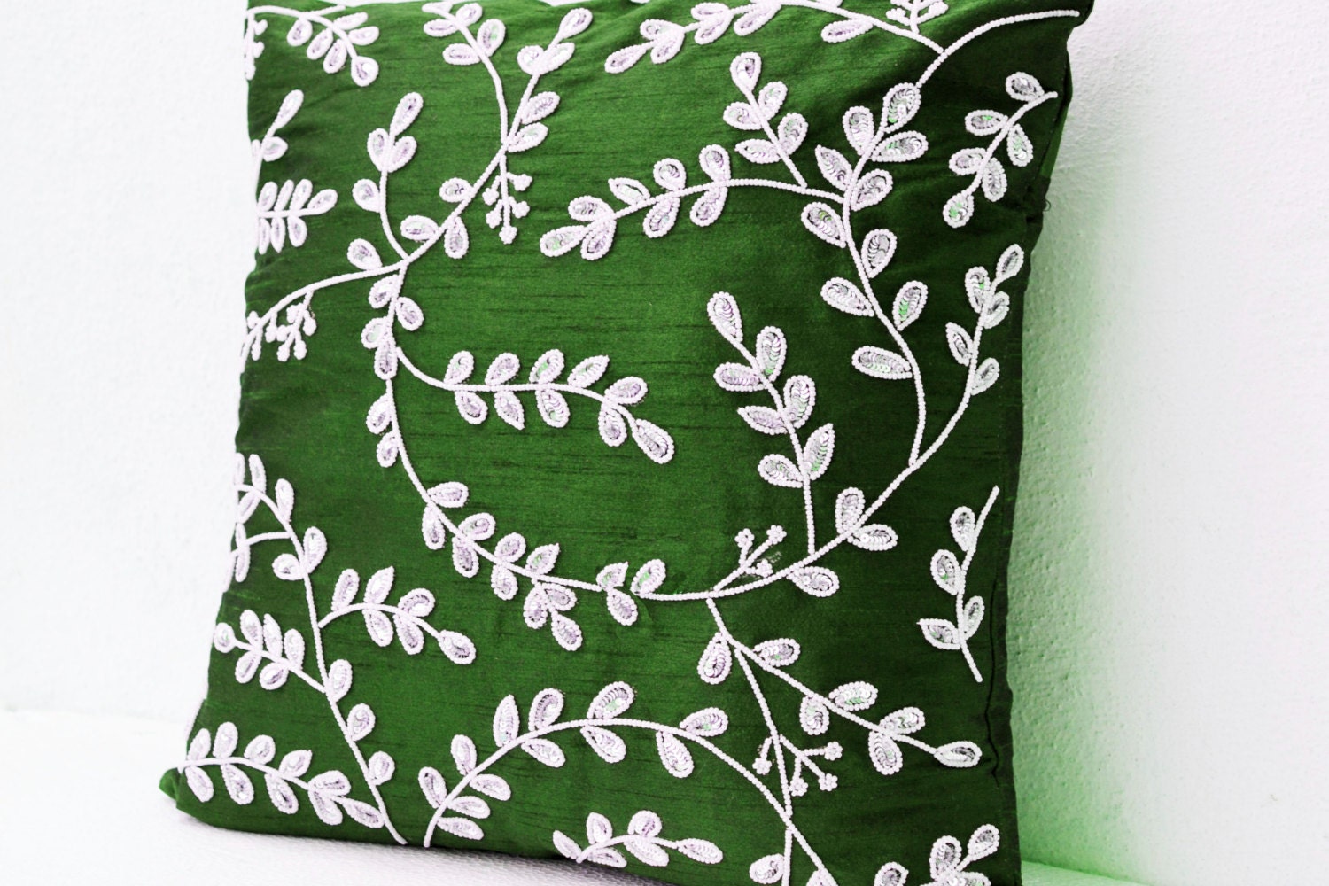 Emerald green throw pillows with bead sequin detail Leaves