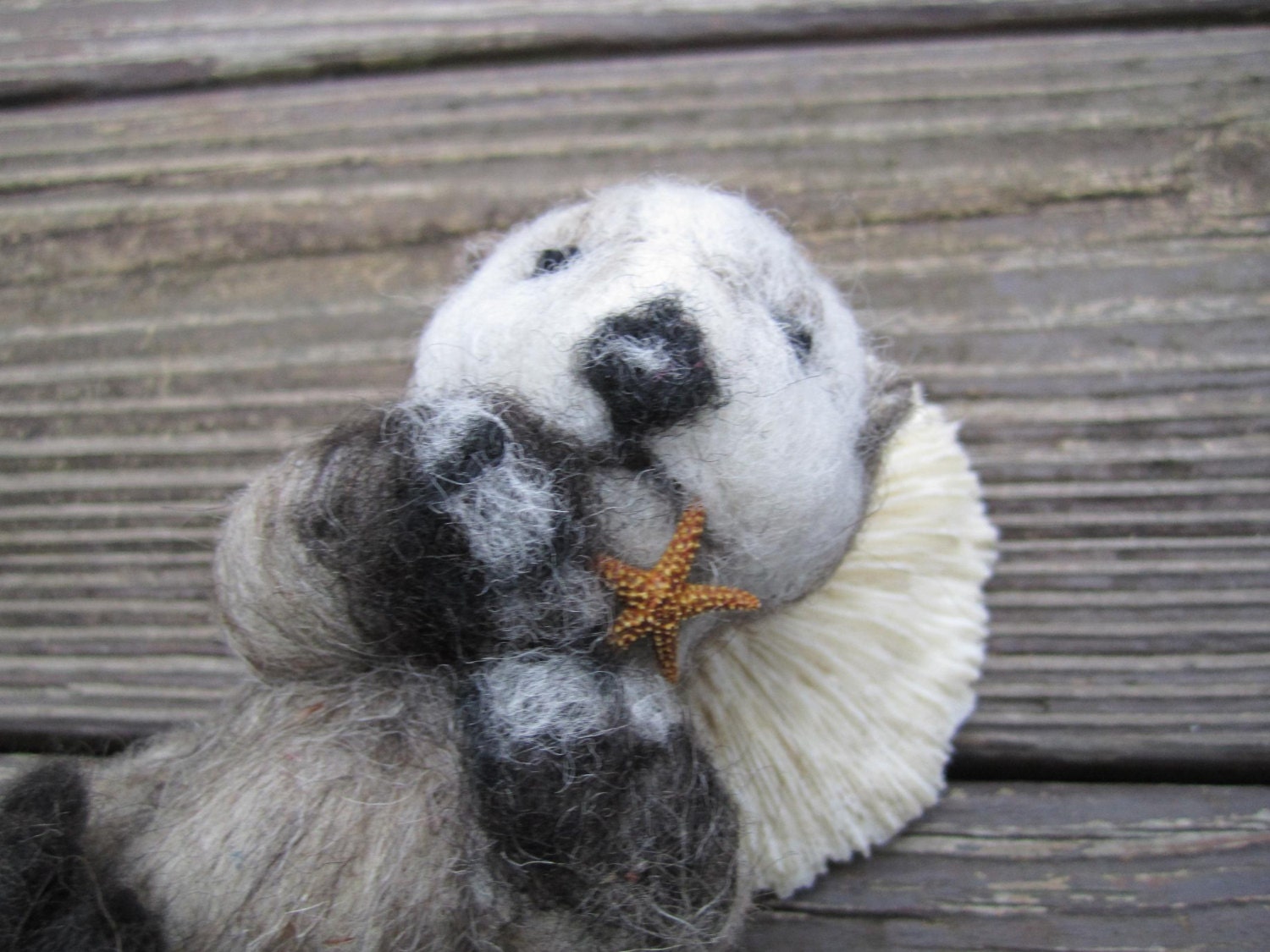 Needle Felted Sea Otter Munching on a Starfish by QueenBeeByTheSea