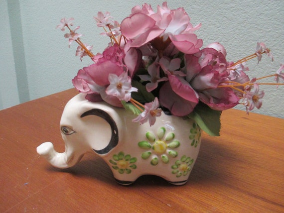 Flower arrangement in a ceramic Mexican Elephant.