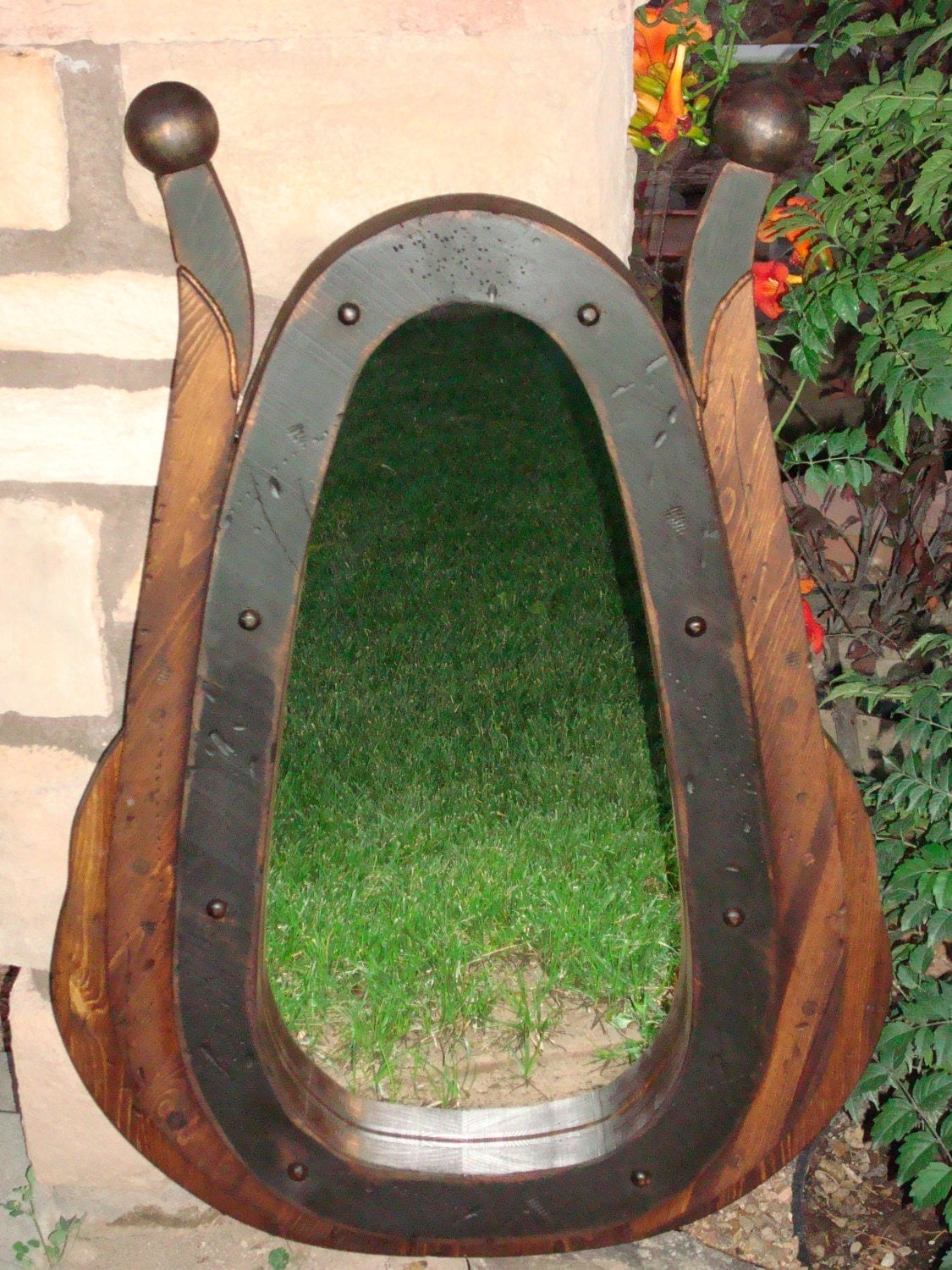 Antiqued wood horse collar mirror.Great wall decor for your