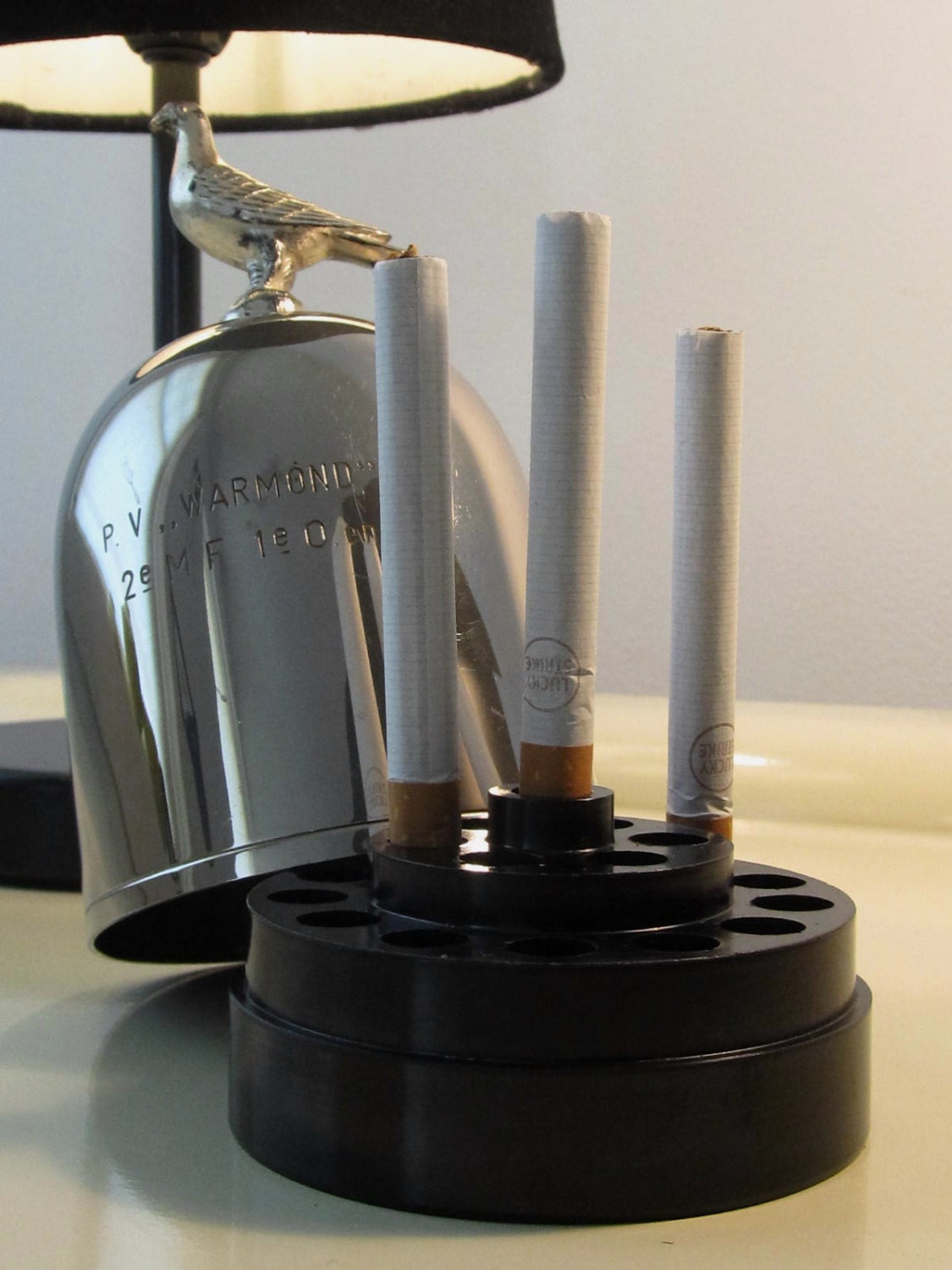 Vintage Round Cigarette Dispenser embellished with a Bird