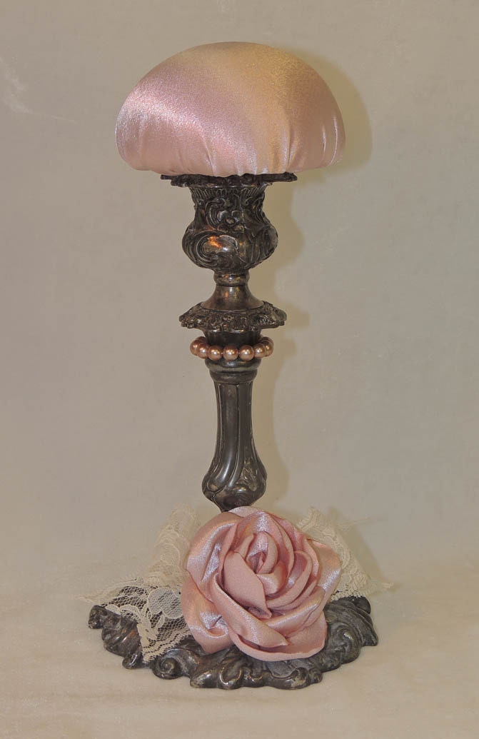 Victorianinspired hat display stand. Antique silver