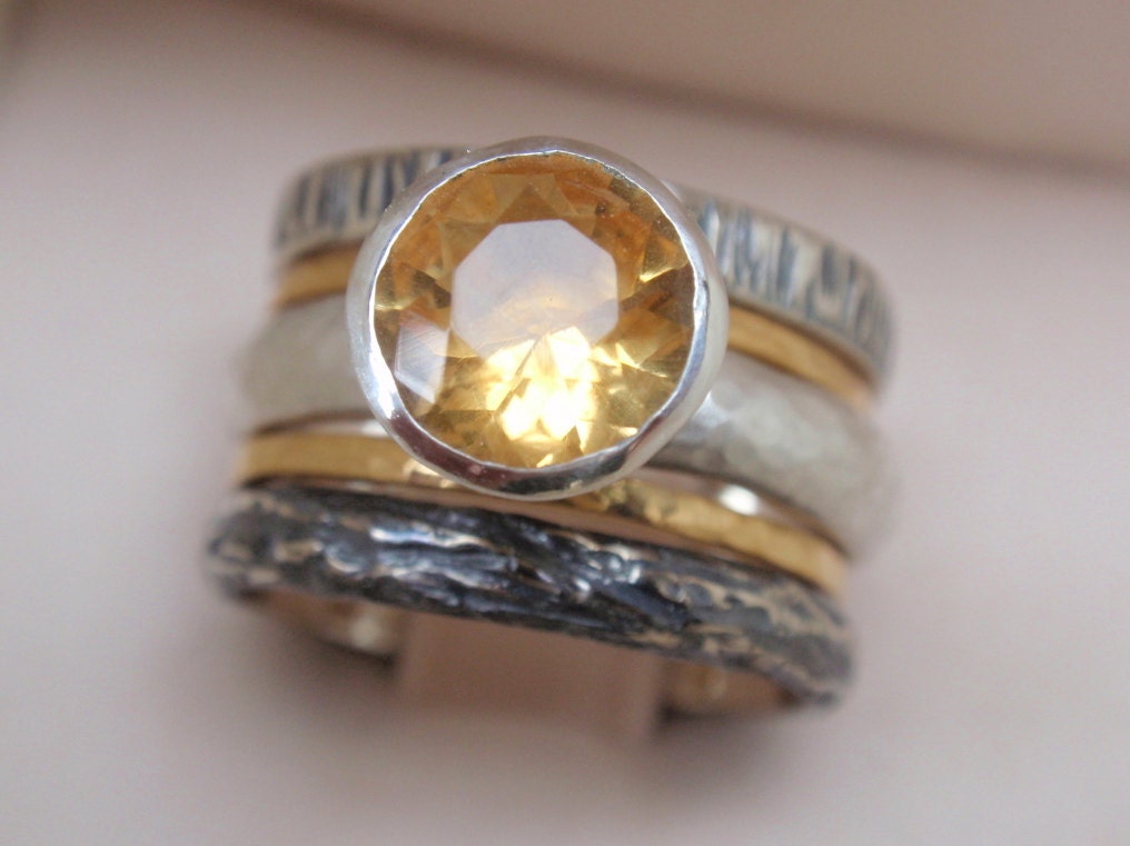 9ct yellow gold 12x10mm emerald cut citrine ring.