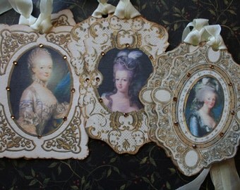 6 Marie Antoinette tags, hand cut framed with rhinestones.