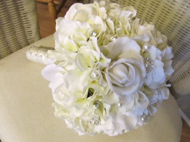 Bridal bouquet in ivory real touch roses and silk hydrangeas and rhinestone brooch emblishments