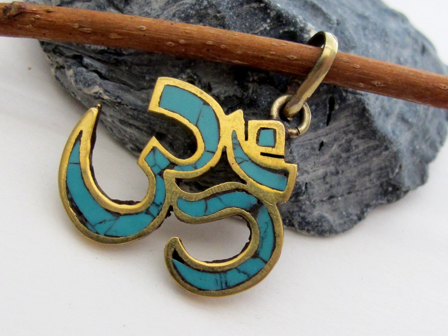 Tibetan brass Om pendant with turquoise inlay