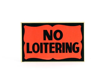 vintage neon cardboard "NO LOITERING" sign