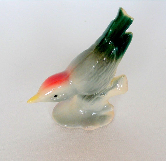 green bird figurine